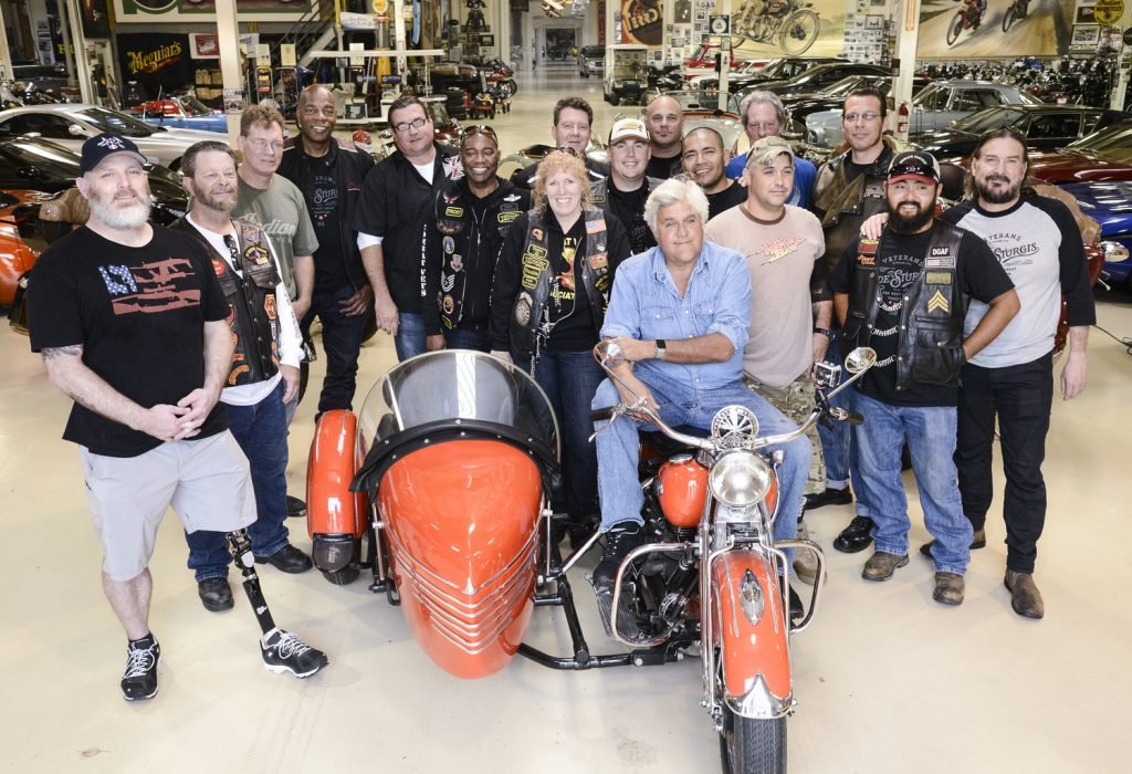Jay Leno leads the inaugural ÒVeterans Charity Ride to SturgisÓ on an Indian Motorcycle in Burbank, Calif. on Monday, July 27, 2015. The ride offers a select group of former military service members the opportunity to make the epic journey from LA to the Black Hills for the 75th annual Sturgis Motorcycle Rally. Sponsored by Indian Motorcycle, several of the models have been outfitted with sidecars to accommodate the riders who are unable to operate a motorcycle themselves due to multiple amputations. (Photo by Dan Steinberg/Invision for Indian Motorcycle/AP Images)
