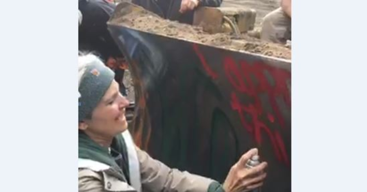 U.S. Presidential Green Party Candidate Dr. Jill Stein tagging one of the bulldozers committing crimes on Native Lands in favor of global oil interests